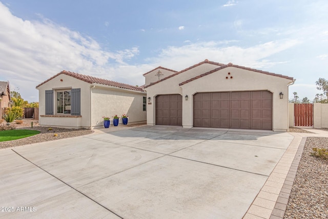 mediterranean / spanish house featuring a garage