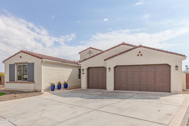 mediterranean / spanish house featuring a garage