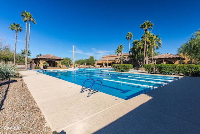 view of swimming pool featuring a gazebo and a patio