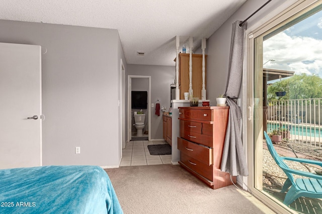 bedroom with light carpet, light tile patterned floors, multiple windows, and access to exterior