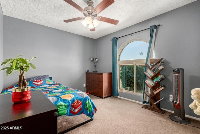 bedroom with a textured ceiling, carpet flooring, and baseboards