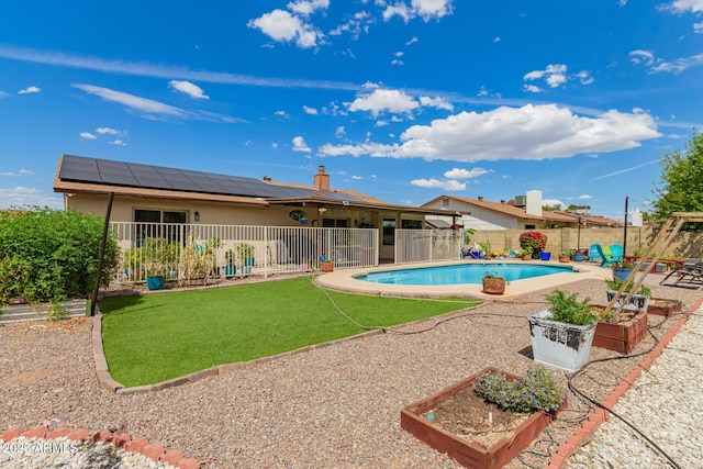 view of pool featuring a patio, a fenced backyard, a fenced in pool, and a vegetable garden