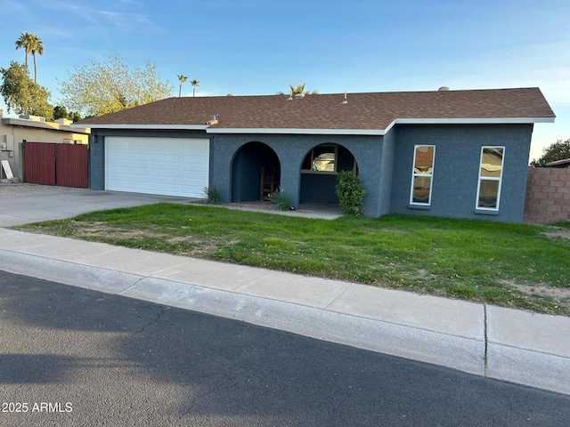 single story home featuring a shingled roof, a front lawn, a garage, stucco siding, and concrete driveway