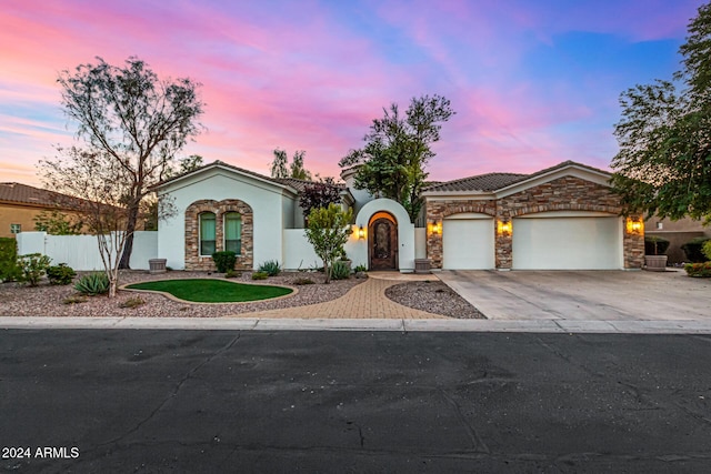 view of front of property with a garage