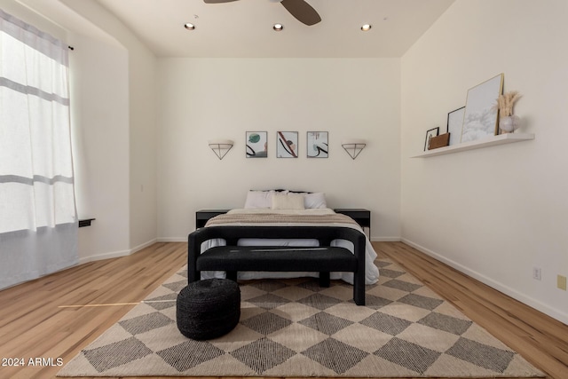 bedroom with ceiling fan and light wood-type flooring