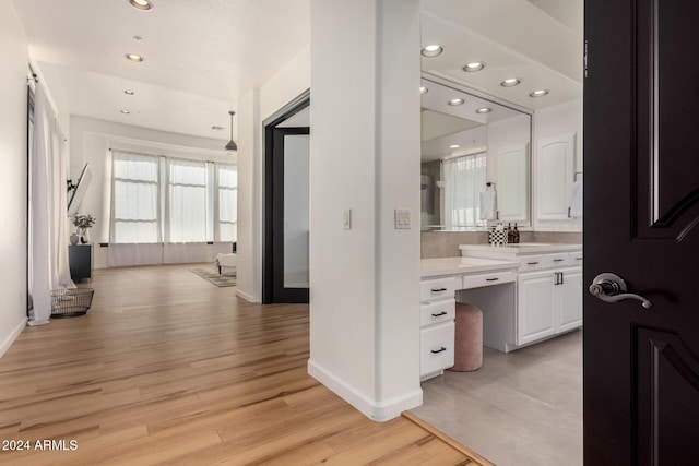 bathroom with vanity and wood-type flooring