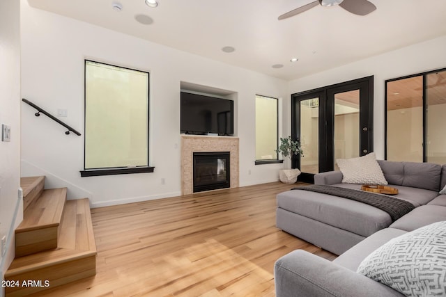 living room featuring hardwood / wood-style flooring and ceiling fan