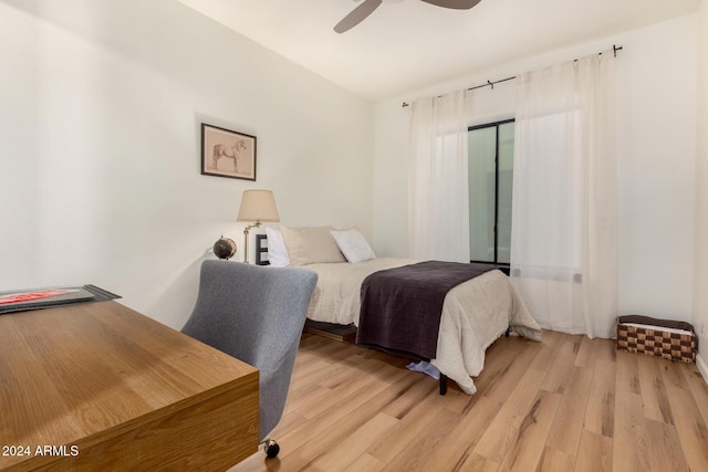 bedroom with ceiling fan and light hardwood / wood-style floors