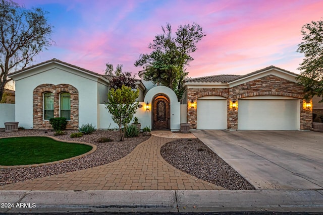 view of front of property with a garage