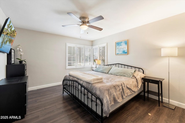 bedroom featuring dark wood-type flooring and ceiling fan