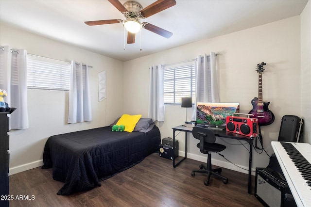 bedroom with ceiling fan and dark hardwood / wood-style floors