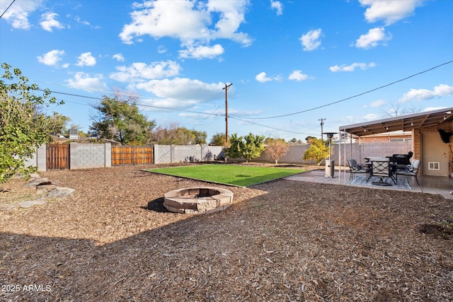 view of yard with a patio area and a fire pit