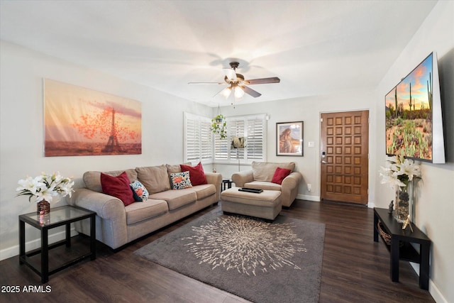 living room with dark wood-type flooring and ceiling fan