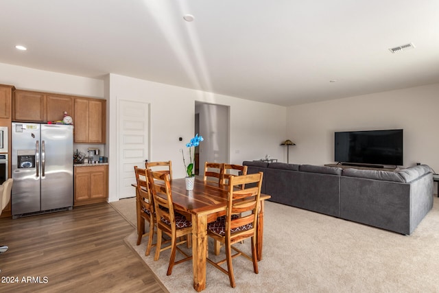 dining space with dark wood-type flooring