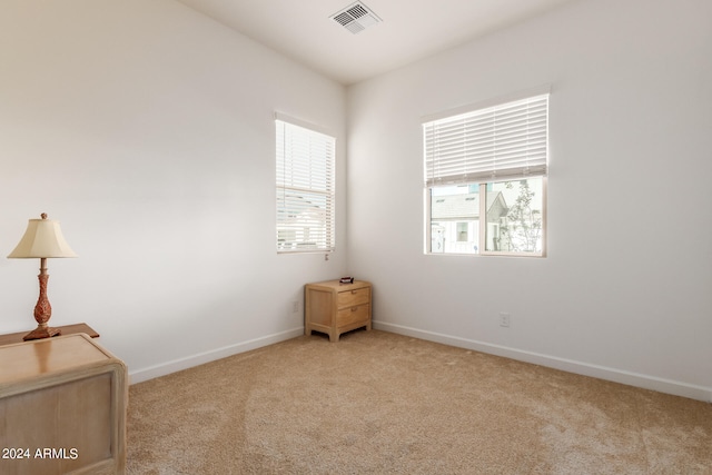 empty room featuring light colored carpet