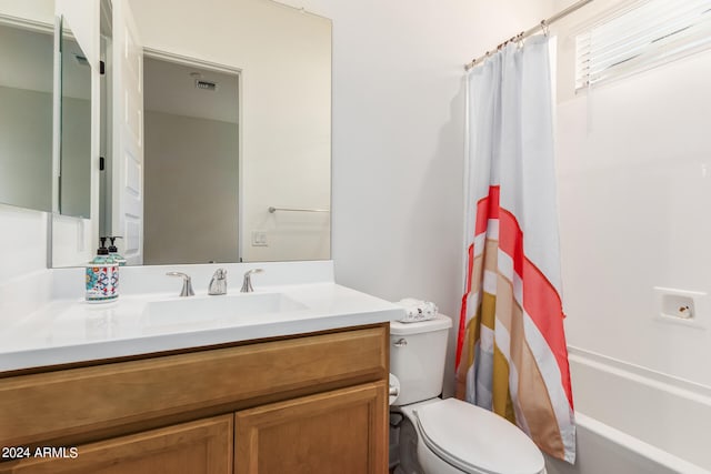 full bathroom featuring vanity, toilet, and shower / bath combo with shower curtain