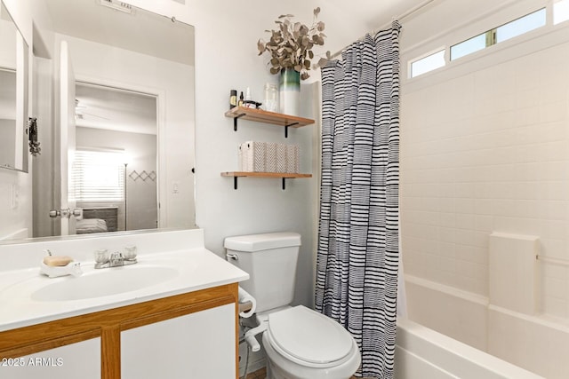 bathroom featuring vanity, toilet, visible vents, and shower / bath combo