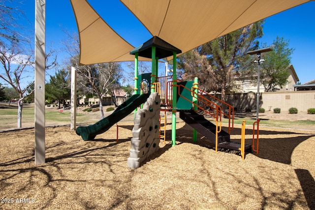 community jungle gym featuring fence