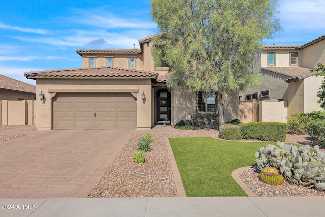 mediterranean / spanish-style house with a front lawn