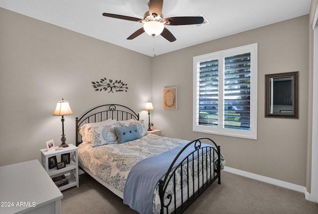 carpeted bedroom with ceiling fan