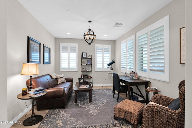 office space with an inviting chandelier