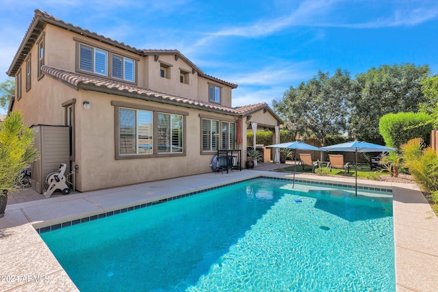 back of house with a patio area