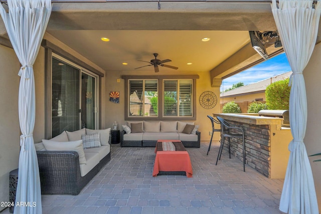 view of patio with outdoor lounge area, a bar, and ceiling fan