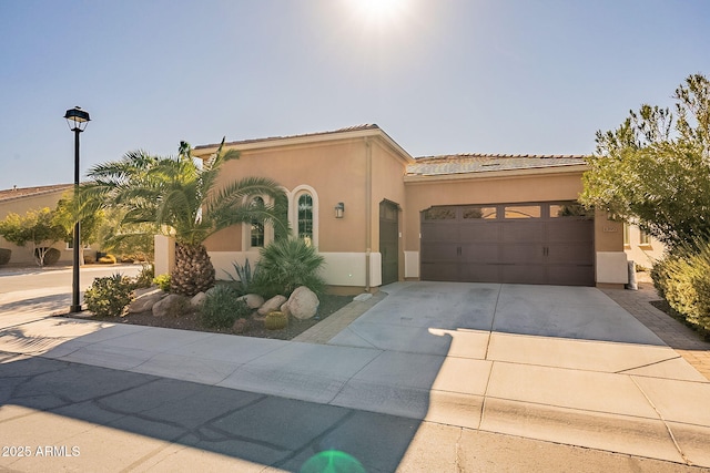 mediterranean / spanish-style house featuring a garage