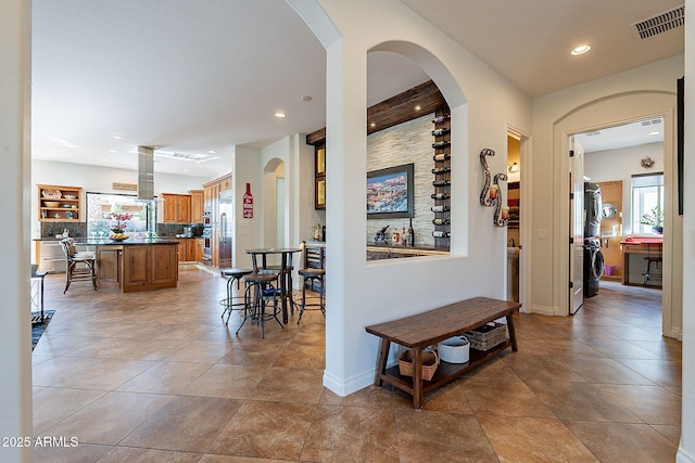 hallway featuring light tile patterned floors