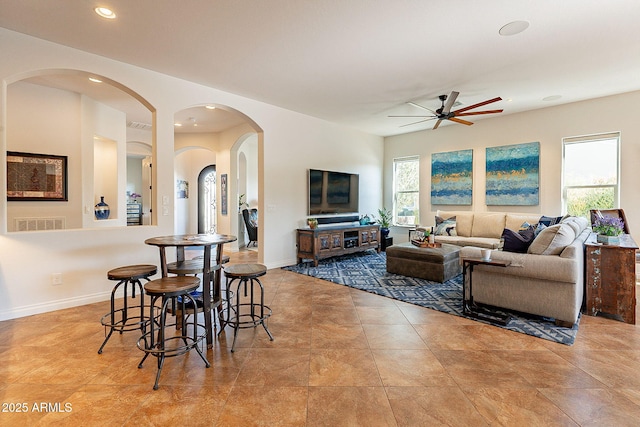 living room featuring ceiling fan