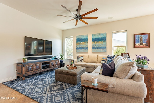 living room with tile patterned flooring and ceiling fan