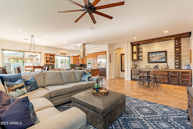 living room featuring wine cooler and ceiling fan