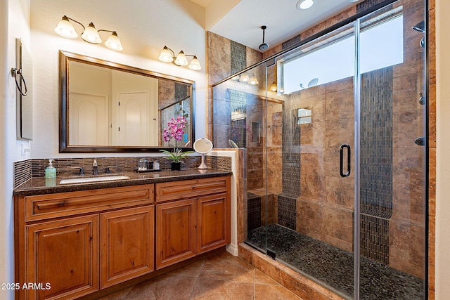 bathroom with an enclosed shower and vanity