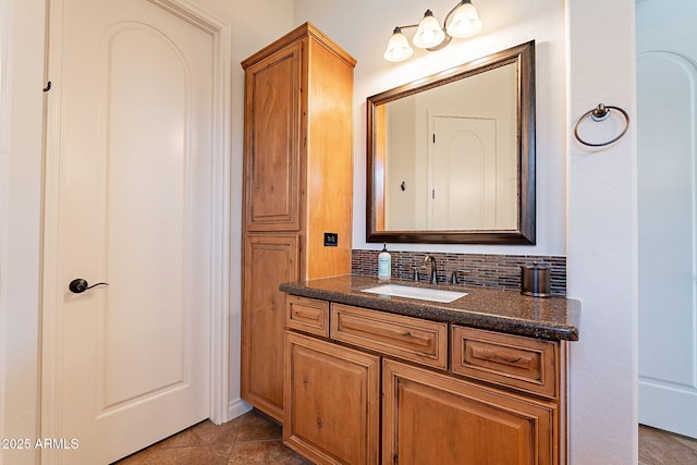 bathroom featuring vanity and backsplash