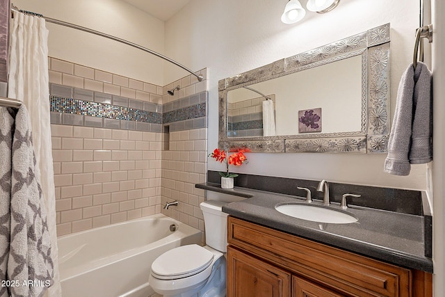 full bathroom featuring toilet, vanity, and shower / bathtub combination with curtain