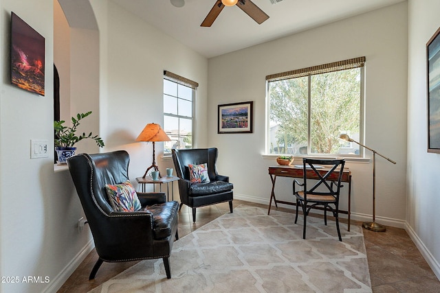 sitting room with ceiling fan