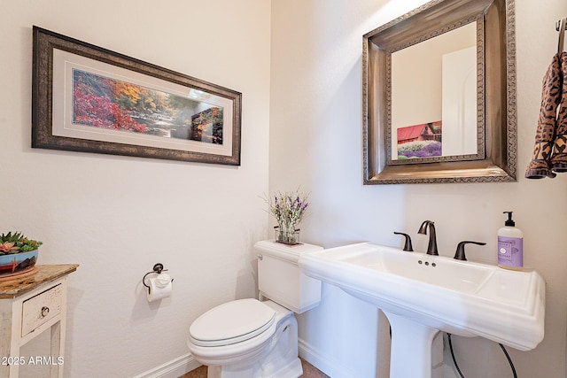 bathroom with toilet and sink