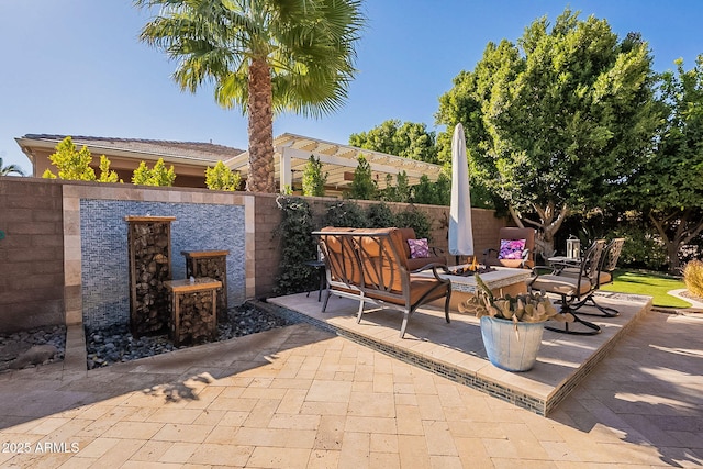 view of patio / terrace with an outdoor fire pit