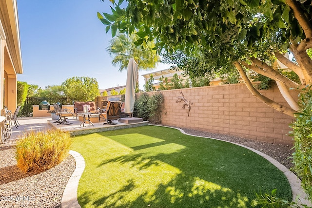 view of yard with an outdoor fire pit and a patio