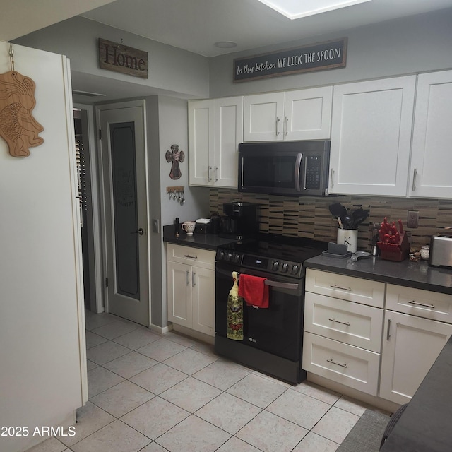 kitchen with white cabinetry, light tile patterned flooring, decorative backsplash, and range with electric stovetop