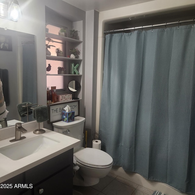 bathroom with a shower with curtain, vanity, tile patterned floors, and toilet