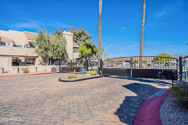 view of gate featuring a residential view and fence