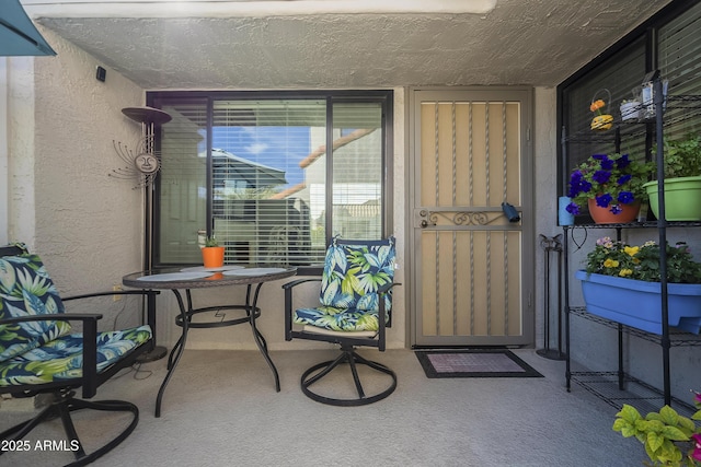 view of exterior entry featuring stucco siding