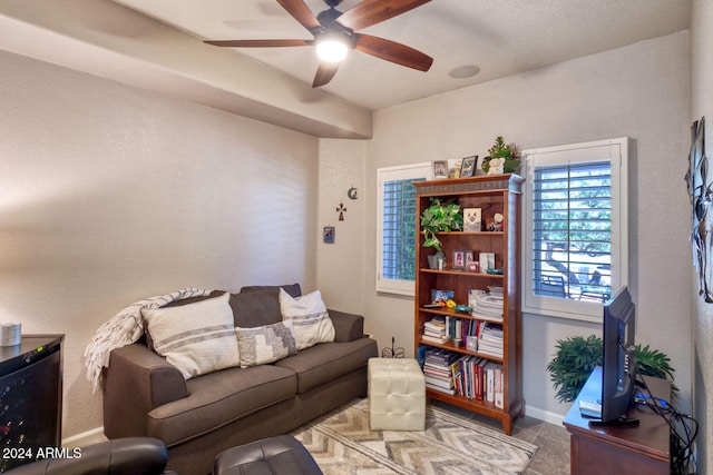 living room featuring tile patterned floors and ceiling fan