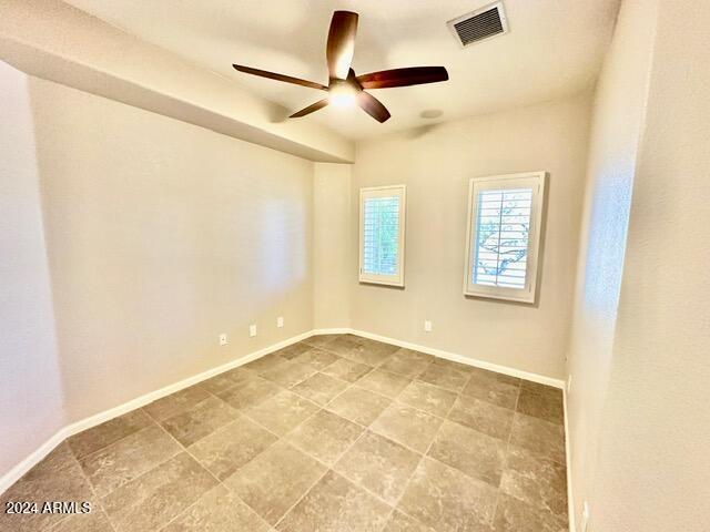 spare room featuring ceiling fan