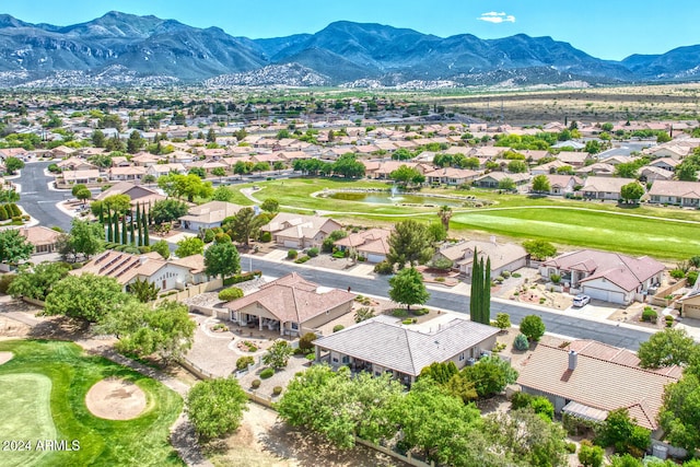 birds eye view of property featuring a mountain view