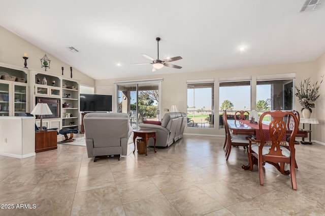 living room with lofted ceiling, baseboards, visible vents, and a ceiling fan