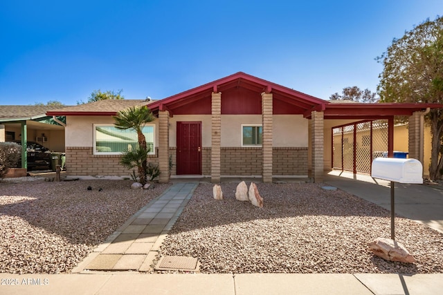 ranch-style home featuring a carport