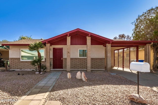 view of front facade with a carport