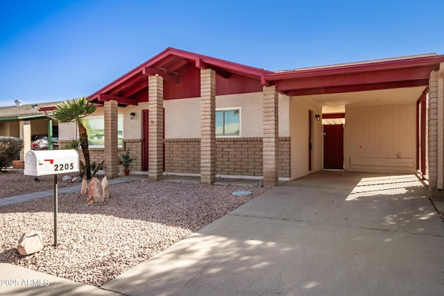 view of front of property with a carport